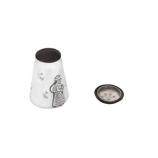 silver Peruvian pepper shaker with gentleman motif top and decorative design on a white background