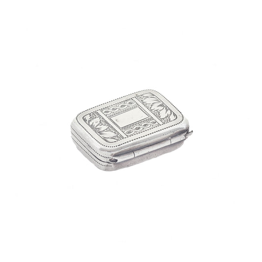 Silver jewelry box with intricate designs on a white background