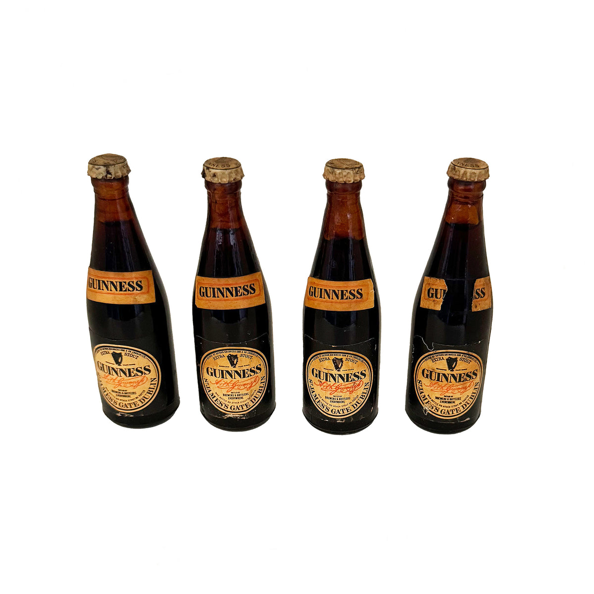 4 Guinness miniature bottles with tops