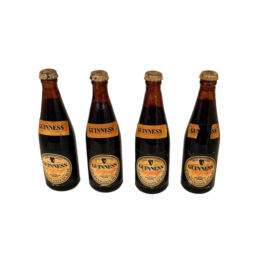 4 Guinness miniature bottles with tops