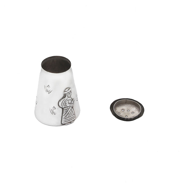 silver Peruvian pepper shaker with gentleman motif top and decorative design on a white background