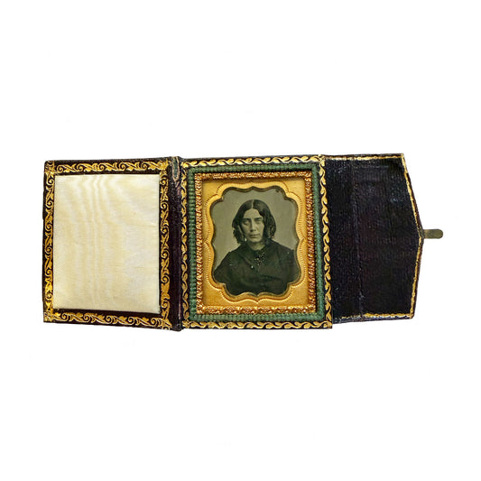 Antique photo album with a portrait inside on a white background