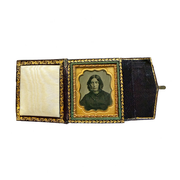 Antique photo album with a portrait inside on a white background