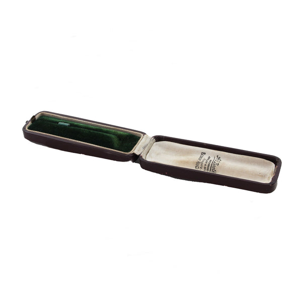 Open stick pin case with green interior on a white background