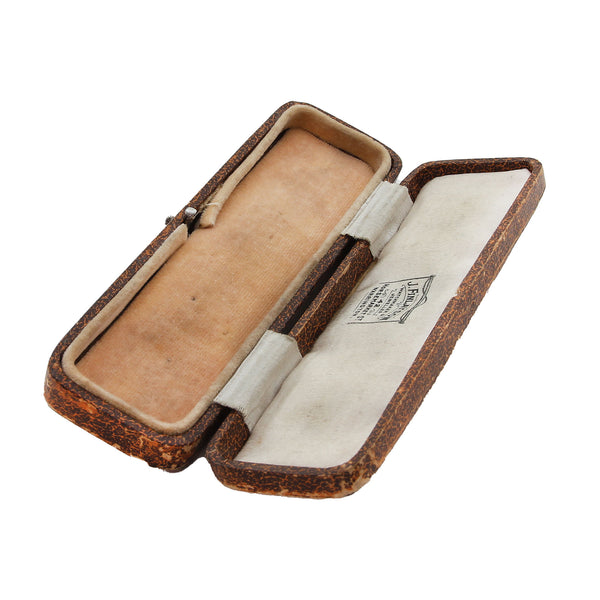 Open brown leather case with beige interior on a white background