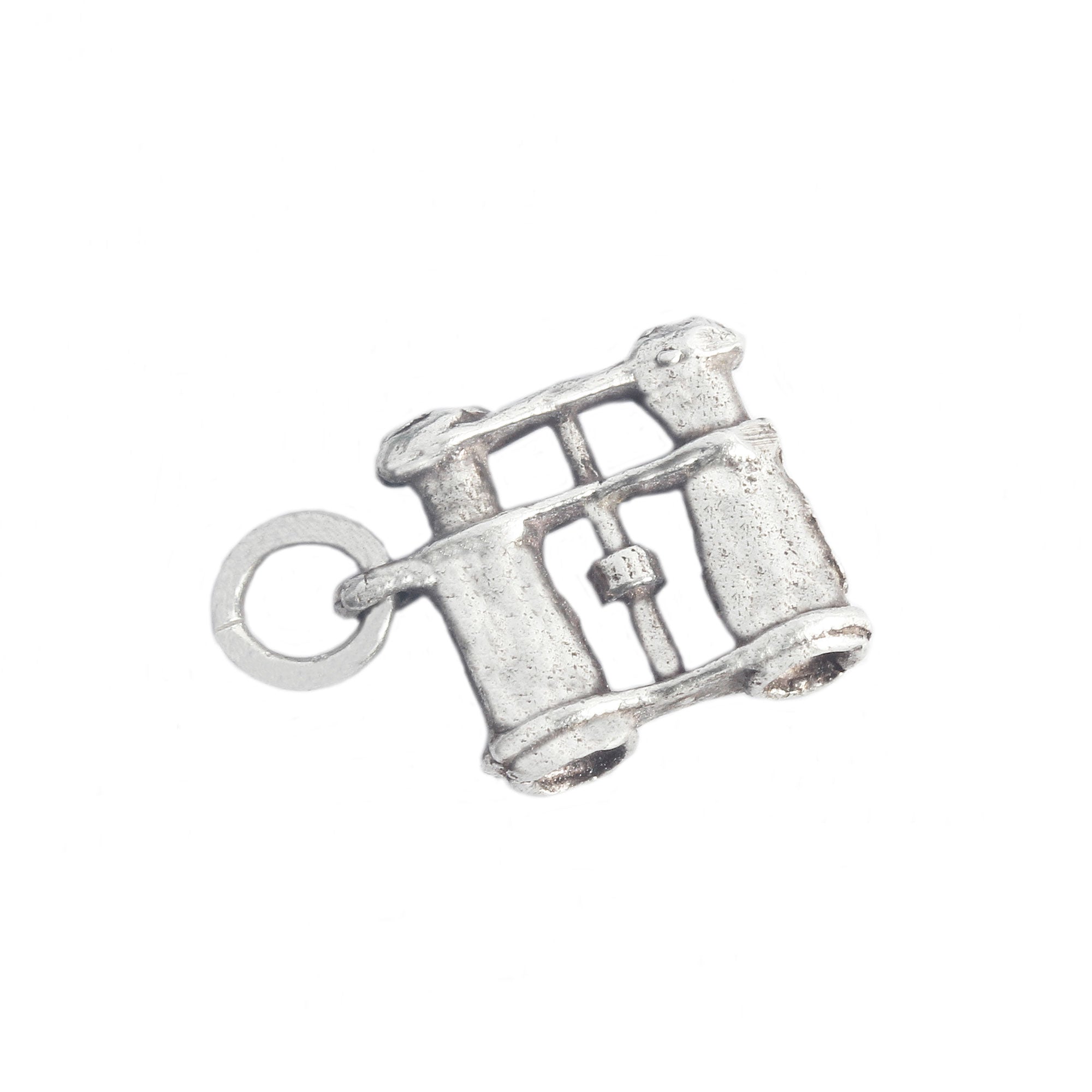 Silver charm resembling a vintage binoculars on a white background