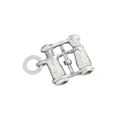 Silver charm resembling a vintage binoculars on a white background