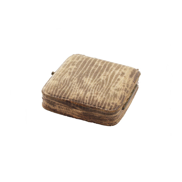 Brown textured cushion on a white background