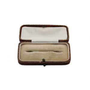 Open jewelry box with a white interior on a white background