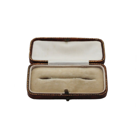 Open jewelry box with a white interior on a white background