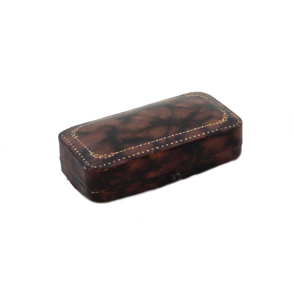 Brown leather box with decorative stitching on a white background