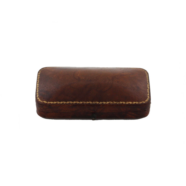 Brown leather box with gold stitching on a white background