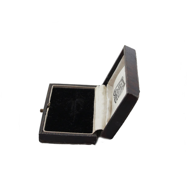 brown jewellery box with a brand logo on a white background