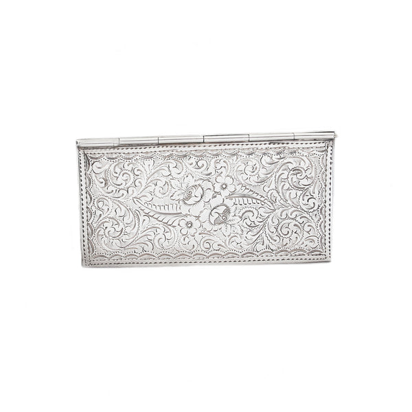 Decorative silver card holder on a white background