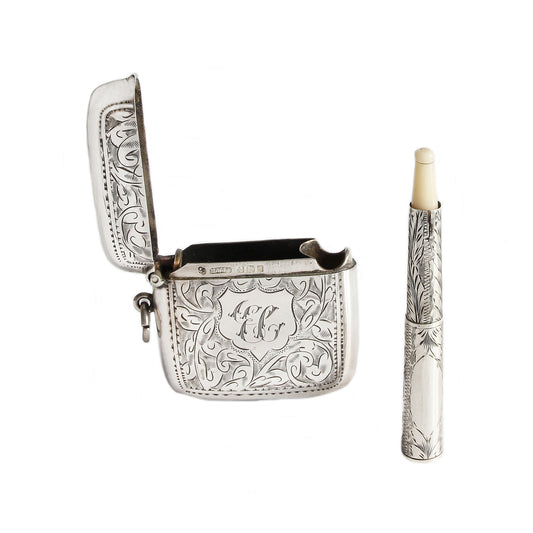 Silver vesta with candle on a white background