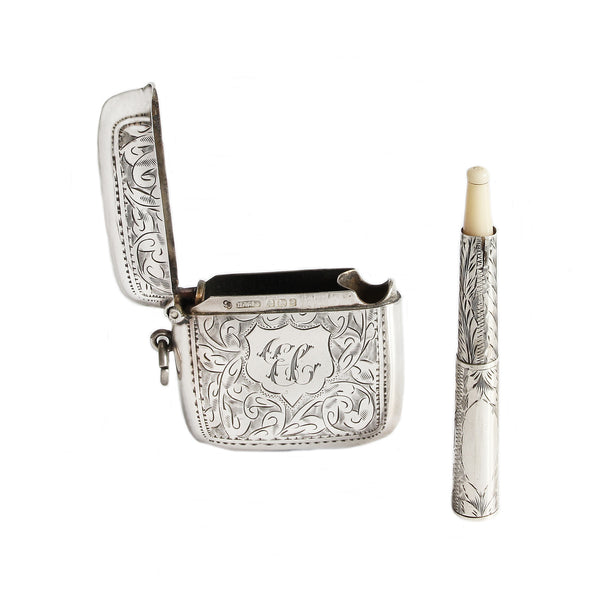 Silver vesta with candle on a white background