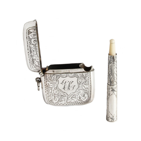 Silver vesta with candle on a white background