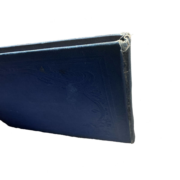 book spine in blue with tatty corner