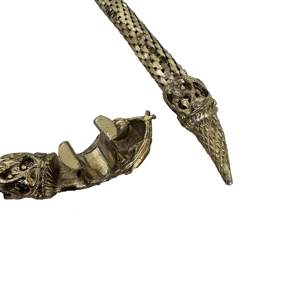 Decorative metal snake belt with intricate design on a white background