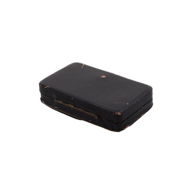 Black rectangular box with a textured surface on a white background