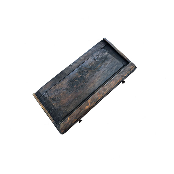 Wooden tray with a dark brown finish on a white background