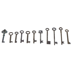 antique rusty set of keys in a line