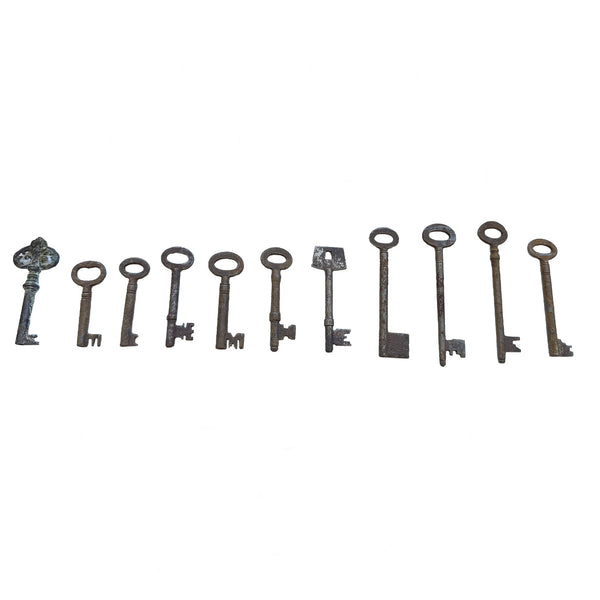antique rusty set of keys in a line
