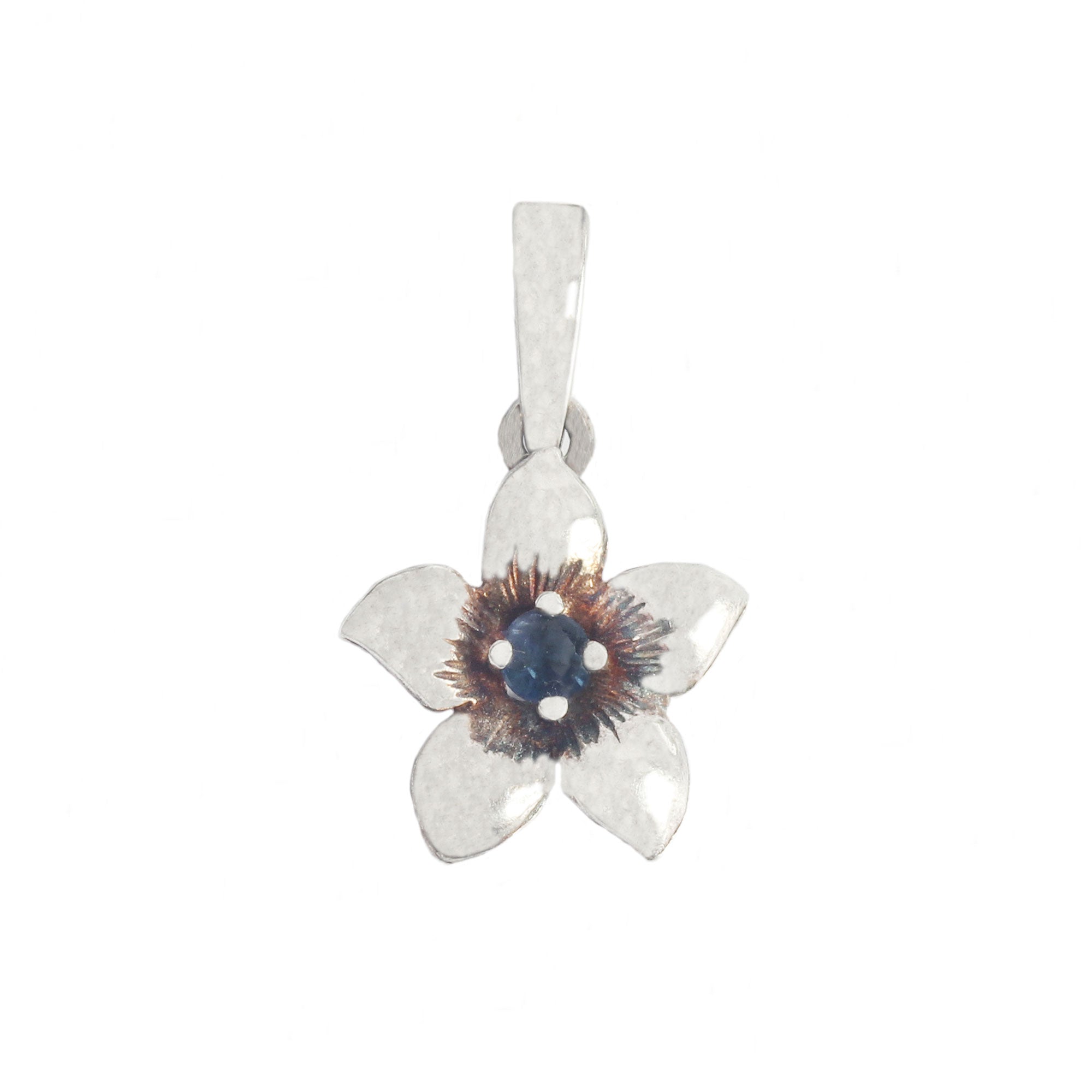 Silver pendant with a floral design and central gemstone on a white background