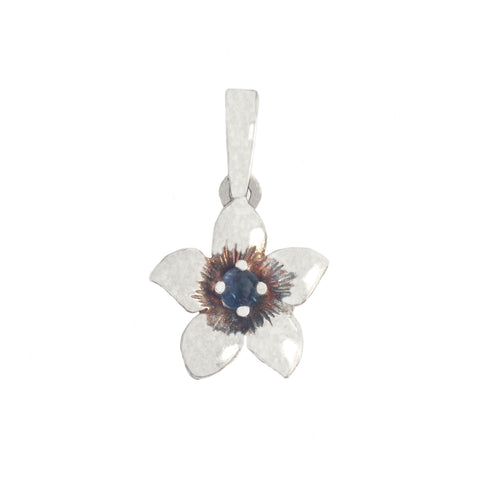 Silver pendant with a floral design and central gemstone on a white background
