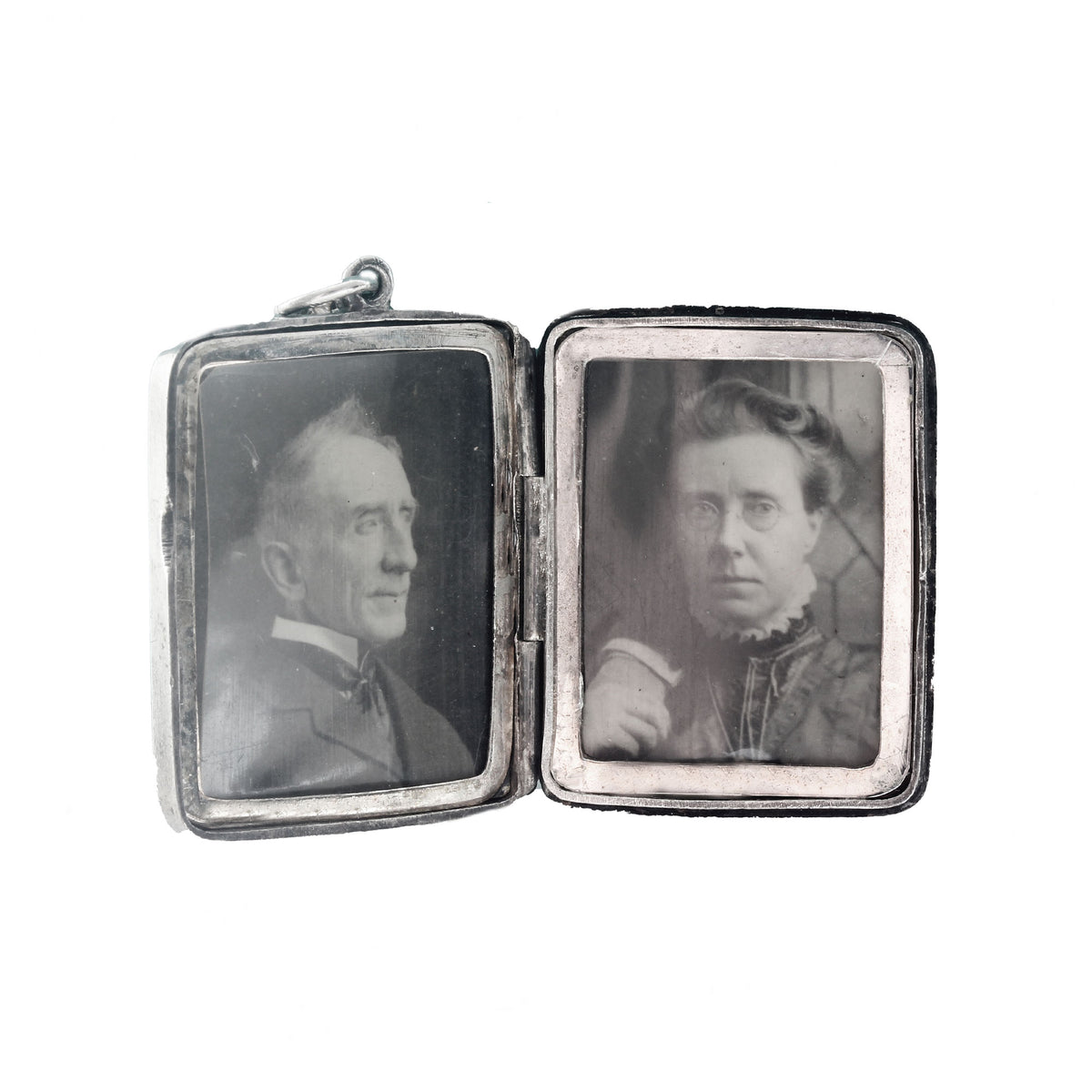 Vintage silver locket with portraits of a man and a woman on two sides.