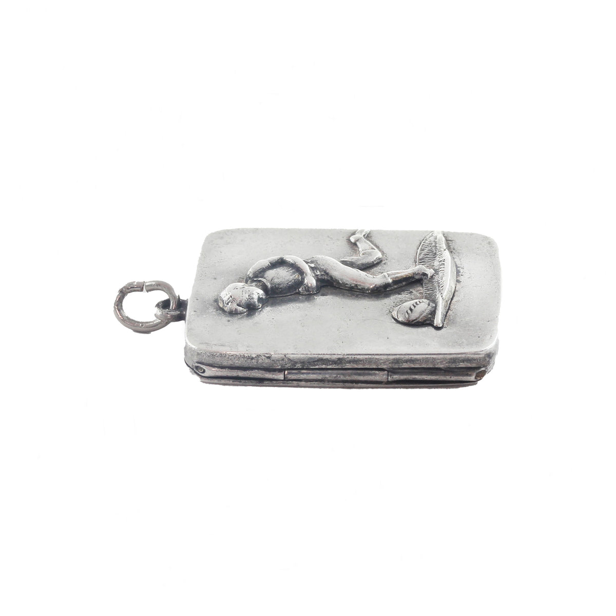 Silver pendant with a design on a white background