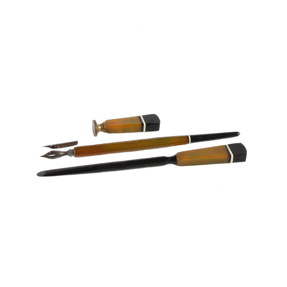 Set of three calligraphy pens on a white background