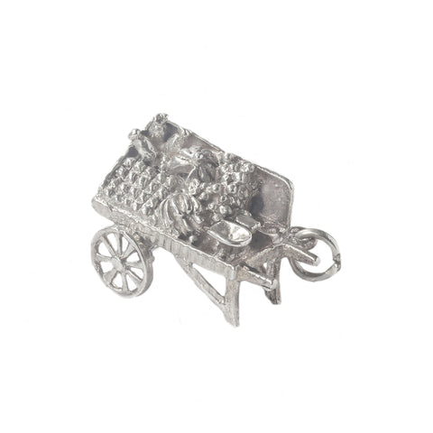 Silver-coloured miniature cart charm on a white background