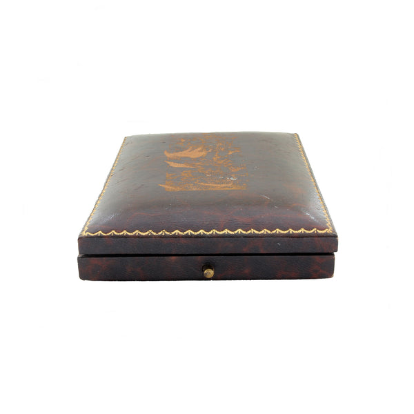 Decorative wooden box with intricate carvings on a white background