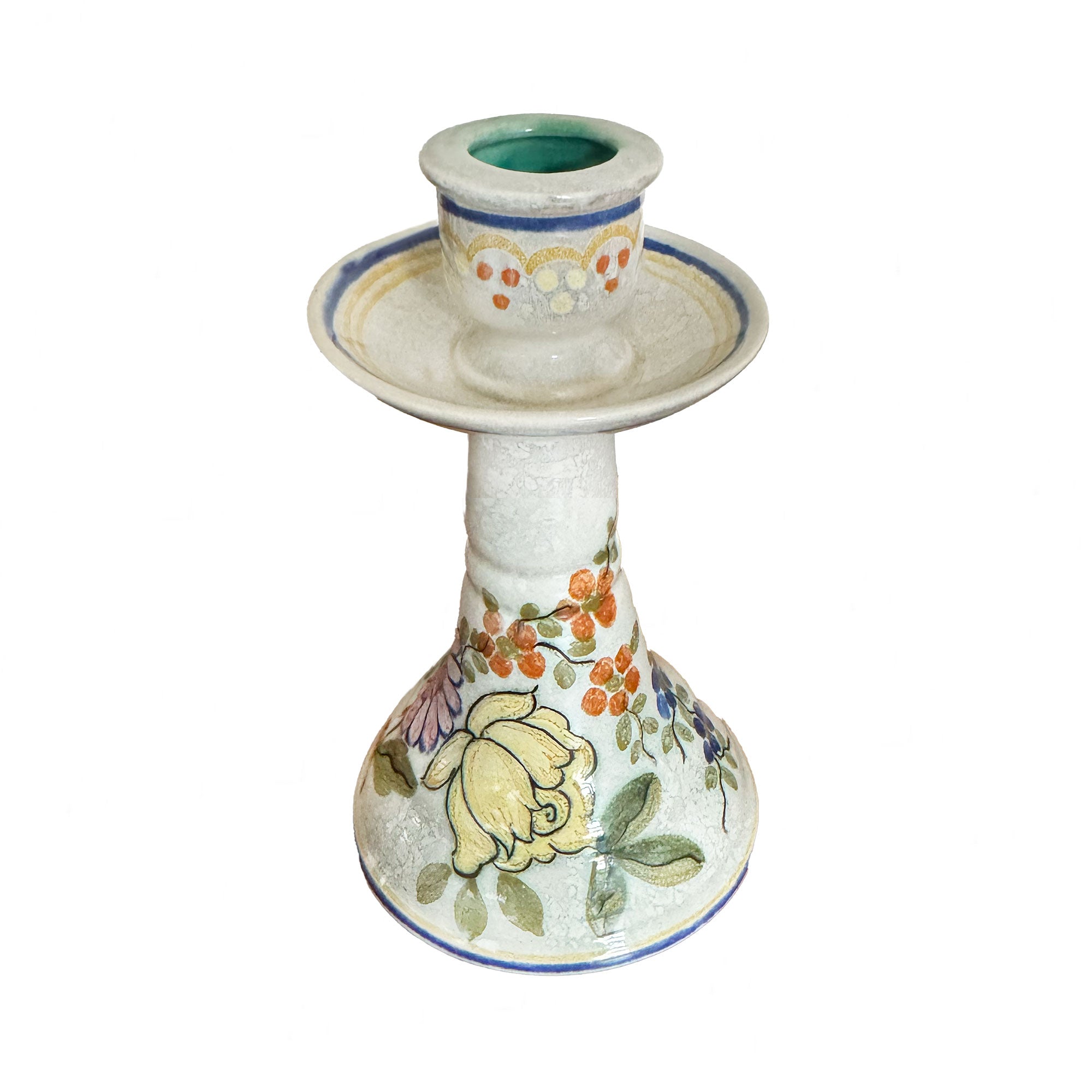 Decorative ceramic candle holder with floral patterns on a white background