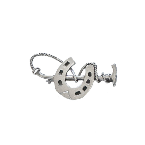 Silver horseshoe and rope design on a white background