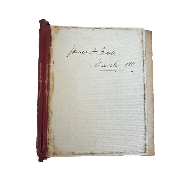 Antique book with red binding and handwritten text on a white background