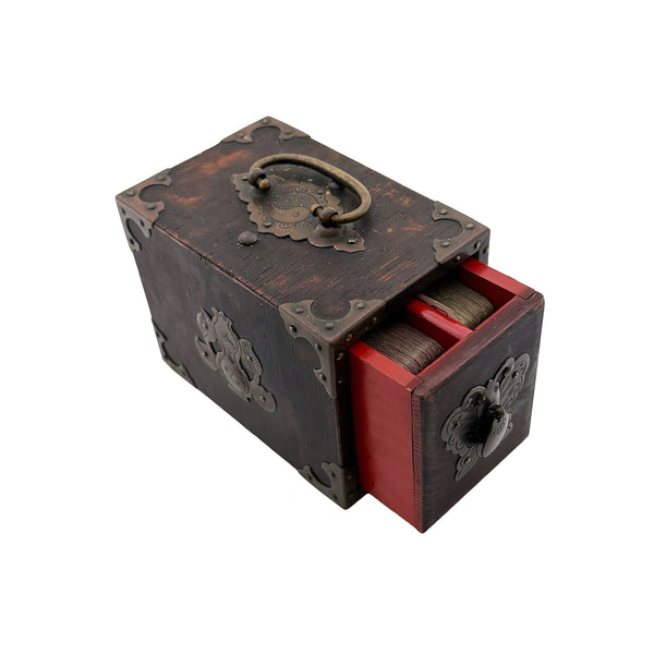Wooden jewelry box with a red interior and decorative metal accents on a white background