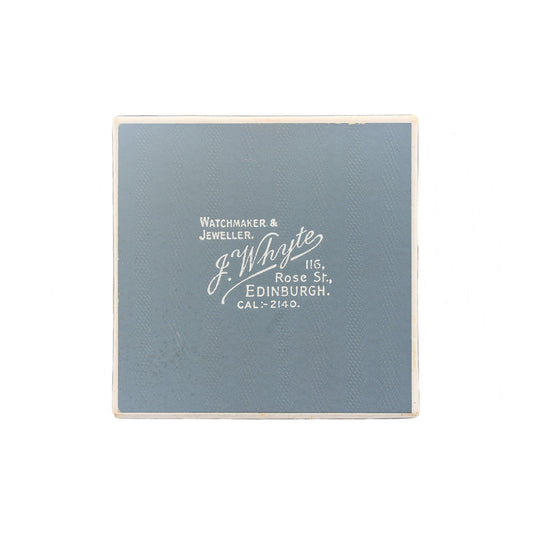 Blue jewelry box with white text on a white background