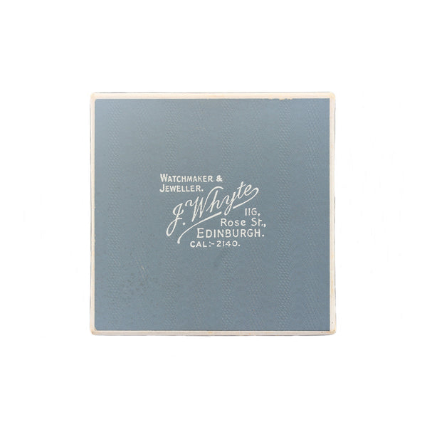 Blue jewelry box with white text on a white background