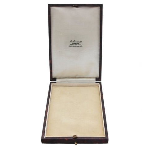 Open jewelry box with a white interior on a white background