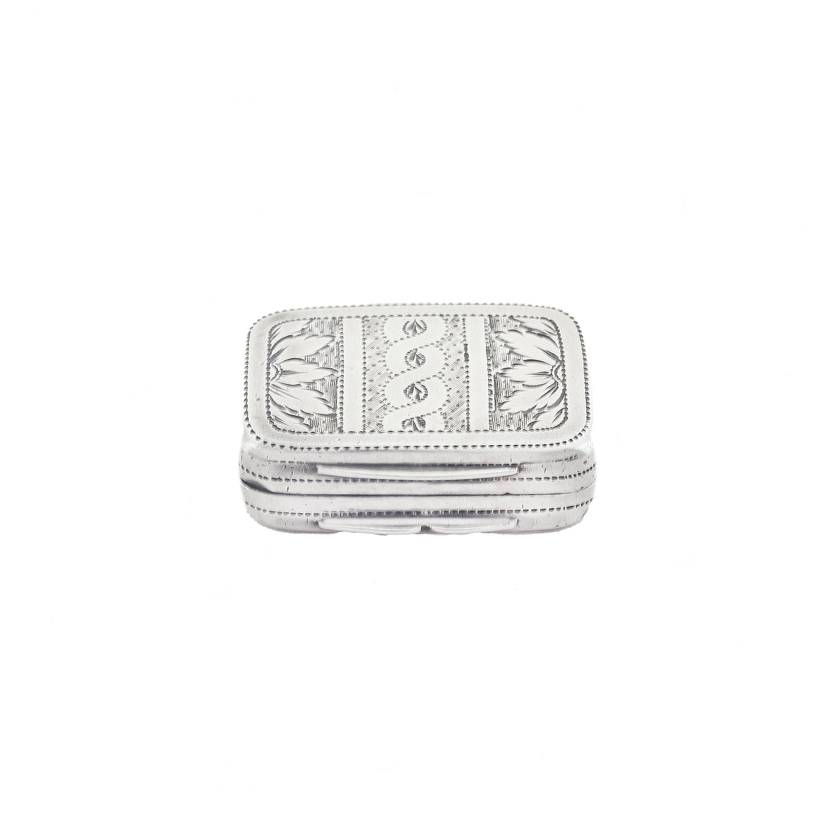 Silver vinaigrette with intricate patterns on a white background