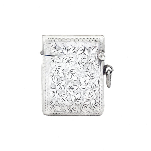 Silver vesta with leaf pattern on a white background