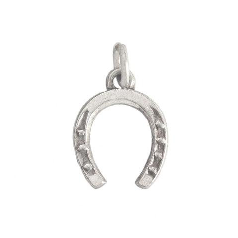 horseshoe charm in silver on white background
