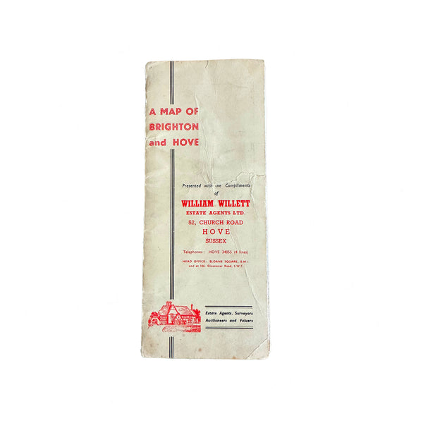 A vintage folded map of Brighton and Hove with the title 'A Map of Brighton and Hove' presented by William Willett Estate Agents Ltd on the cover.