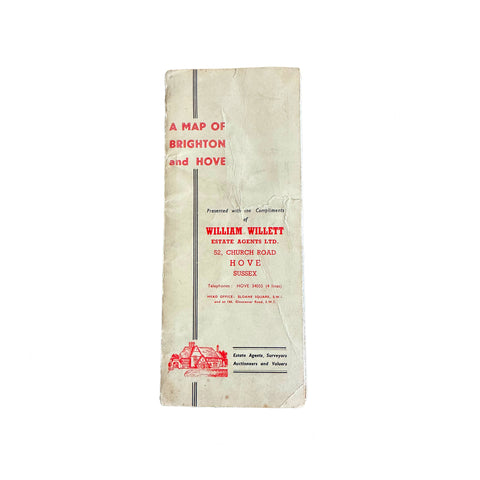 A vintage folded map of Brighton and Hove with the title 'A Map of Brighton and Hove' presented by William Willett Estate Agents Ltd on the cover.