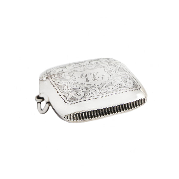 Silver match vesta with engraved design on a white background