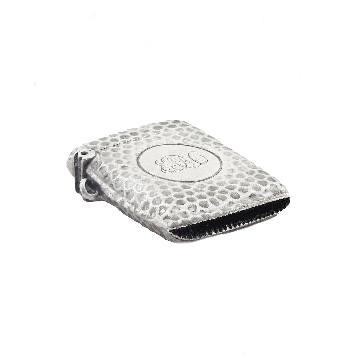 Silver matches case with textured surface and circular emblem on a white background