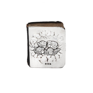 Decorative book with angel designs on a white background