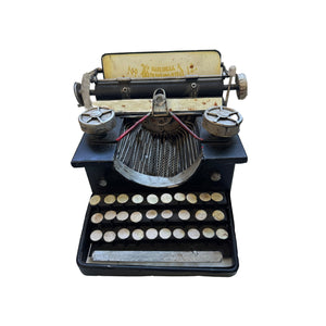 Vintage American Hammond typewriter, model No. 12, with a metal base and hand-painted keys, primarily in black color.